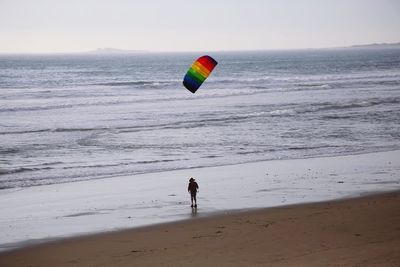 People surfing on beach