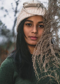 Portrait of smiling young woman in winter