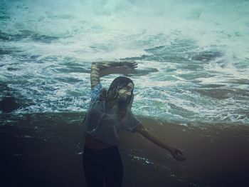 Woman standing in sea