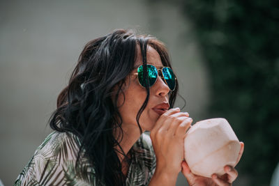 Portrait of woman holding ice cream