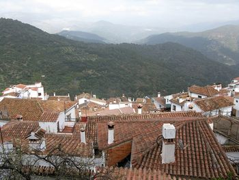 High angle view of townscape against mountains in alpandeire