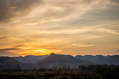 Scenic view of mountains against sky during sunset