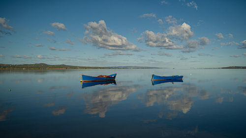 Boat in the water. fishing boat in the calm waters of the pond santa caterina in southern sardinia