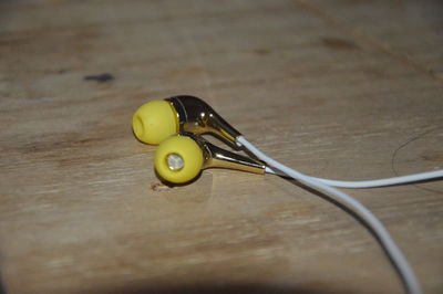 High angle view of yellow container on table