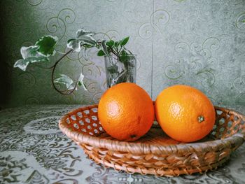 Close-up of orange fruits in basket