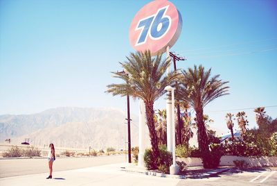 Man standing on road against clear sky