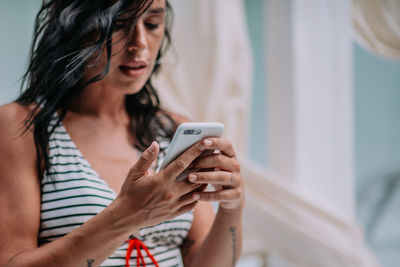 Young woman using mobile phone