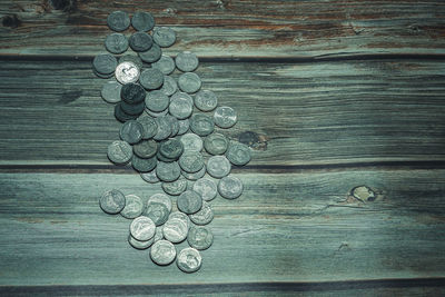 High angle view of coins on table