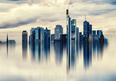Panoramic view of sea and cityscape against sky