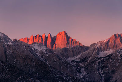 Scenic view of mountains against sky during sunrise