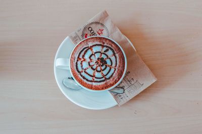 High angle view of coffee cup on table