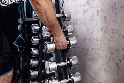 Midsection of man standing in gym