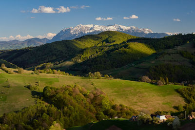 Scenic view of landscape and mountains against sky