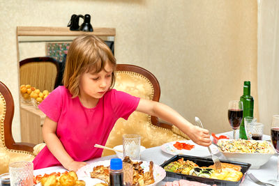 Portrait of smiling woman preparing food at home