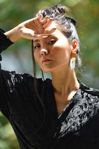 Portrait of young woman looking away