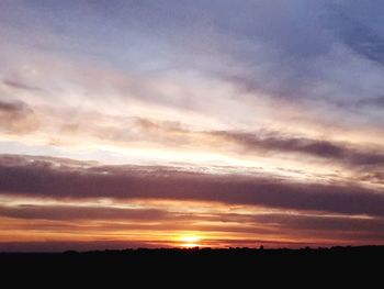 Scenic view of dramatic sky during sunset