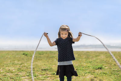 Full length of woman standing on field