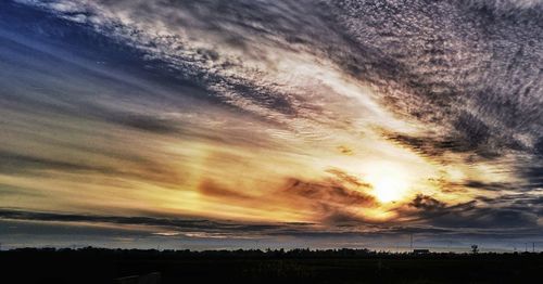 Scenic view of dramatic sky during sunset