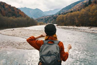 Rear view of man looking at mountains