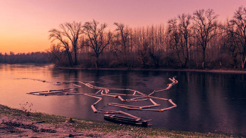 Scenic view of lake against sky during sunset