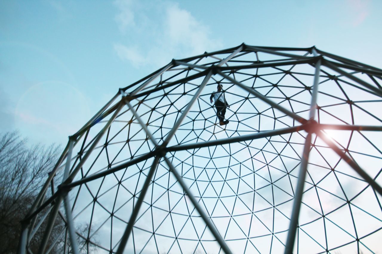 sky, low angle view, built structure, architecture, day, nature, shape, no people, building exterior, geometric shape, pattern, outdoors, metal, cloud - sky, building, industry, construction industry, glass - material, design, animals in the wild, directly below