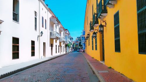 Narrow alley amidst buildings in city