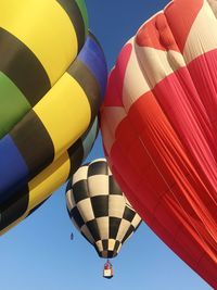 Low angle view of hot air balloon against clear blue sky