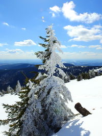 Scenic view of snow covered mountains against sky