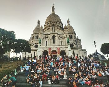 People at temple against clear sky