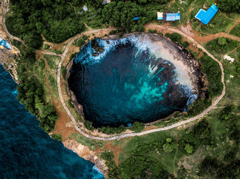 Aerial view of sea by land