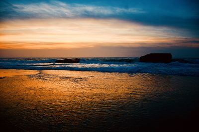 Scenic view of sea against sky during sunset