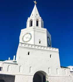 Low angle view of clock tower against sky