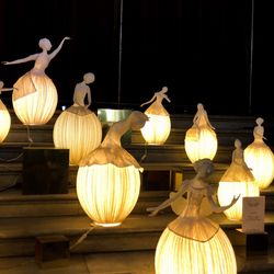 Low angle view of illuminated lanterns hanging at night