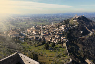 Extended aerial view of the city of assisi at dawn