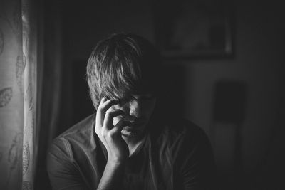 Portrait of person wearing hat at home