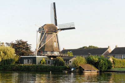 Traditional windmill against sky