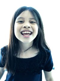 Portrait of a smiling girl over white background