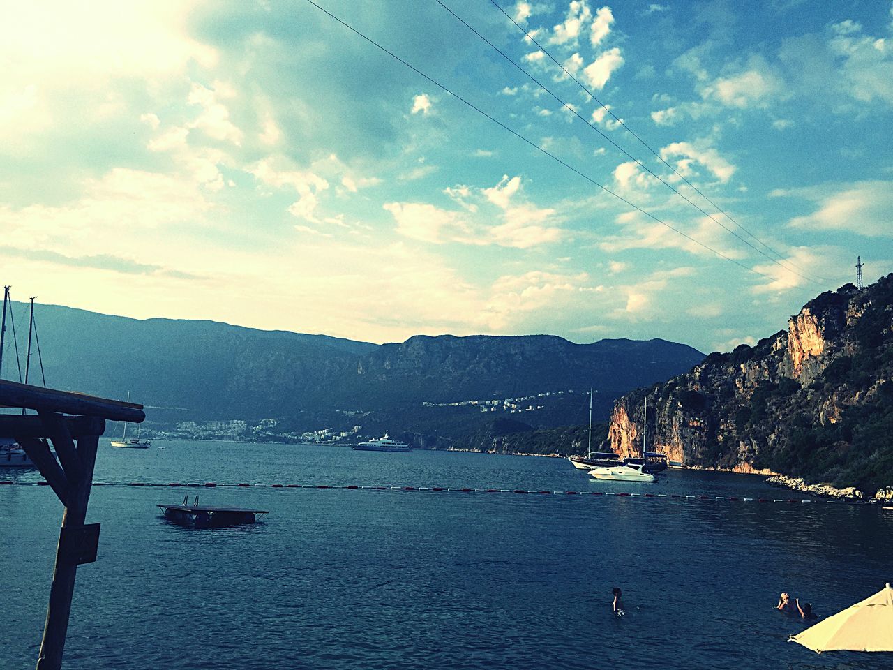 water, sky, nautical vessel, cloud - sky, mountain, transportation, sea, boat, mode of transport, cloudy, cloud, scenics, tranquil scene, tranquility, beauty in nature, nature, moored, waterfront, mountain range, harbor