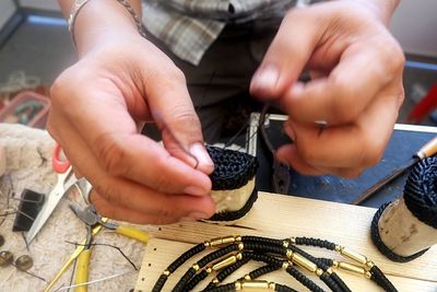 Midsection of man working at workshop