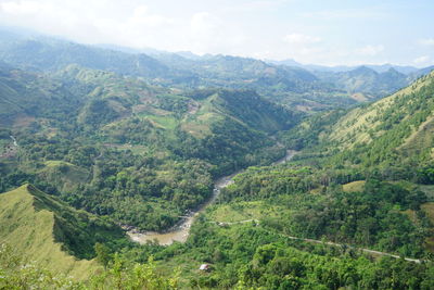 High angle view of trees and mountains against sky