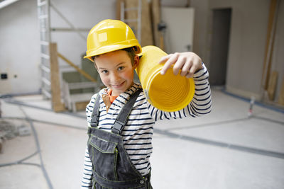 Rear view of man working at construction site