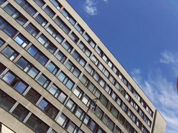 Low angle view of office building against sky