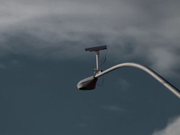 Low angle view of street light against sky