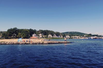 Scenic view of sea against clear blue sky