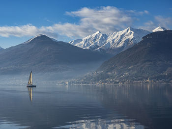 Single sail boat on lake como