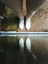 Low section of woman standing on floor
