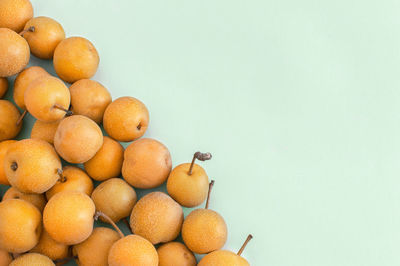 Close-up of oranges against white background