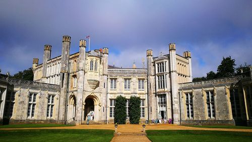 Facade of historical building against blue sky