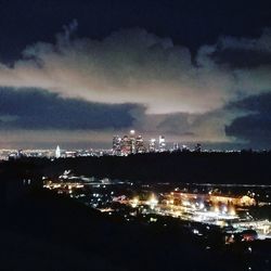 Illuminated cityscape at night