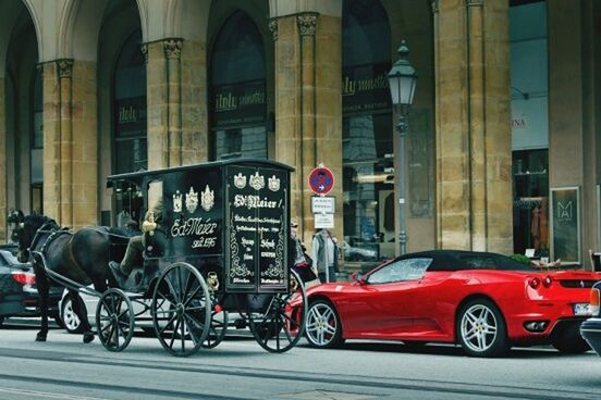 transportation, land vehicle, mode of transport, car, architecture, street, building exterior, built structure, city, road, travel, bicycle, stationary, parked, parking, city street, city life, motorcycle, on the move, traffic